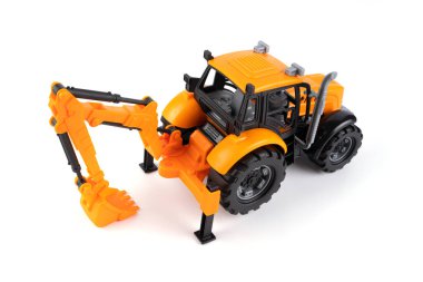 Traktör. Kazıcı. Sınıf. Çocuk oyuncağı. Beyaz arka planda çocuk oyuncağı. Yüksek kalite fotoğraf