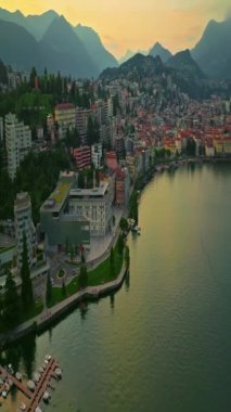 Lugano şehrinin havadan görünüşü ve San Salvatore dağından Lugano Gölü. İsviçre, Canton Ticino 'daki Lugano şehrine bakan Monte Bre' nin hava görüntüleri..