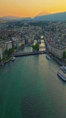 Cenevre, İsviçre 'de, Leman Gölü' nün güneybatısında yer alan bir şehirdir. Bir İHA gece şehrin üzerinde uçuyor. Köprülerin ve caddelerin üzerinden. İçi araba ve insan dolu..