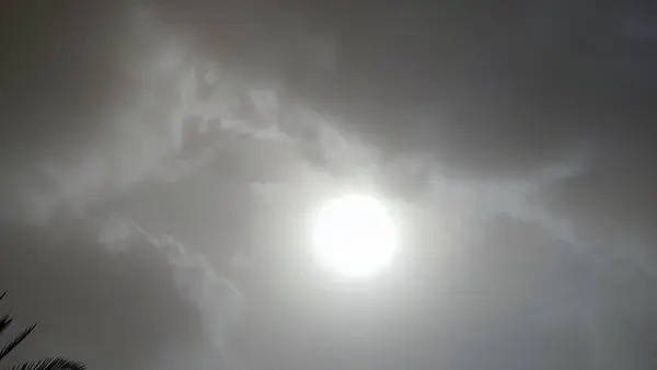Gray sky white sun background. High quality photo