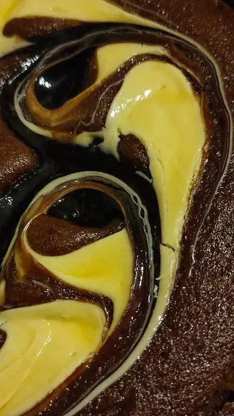 chocolate cake sponge cake with yellow cream, dessert sweets food. High quality photo