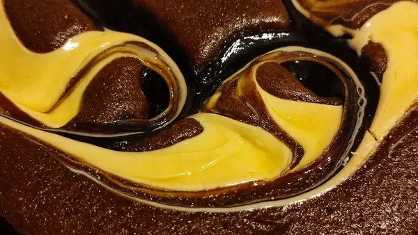 chocolate cake sponge cake with yellow cream, dessert sweets food. High quality photo