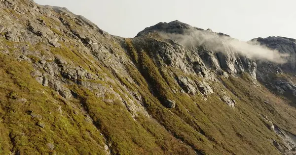 stock image Ascend to the Clouds: Aerial Majesty of Lofotens Peaks. High quality 4k footage