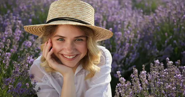 stock image Smiling Young Woman Relaxing Amongst Lavender in the Golden Hour. High quality 4k footage