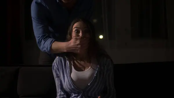 stock image Desperate Silencing: Man Covers Womans Mouth in a Moment of Panic. High quality 4k footage