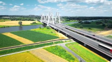 Modern suspension bridge on the outskirts of Krakow. Bird's-eye view shot recorded by a drone. Cardinal Franciszek Macharski Bridge