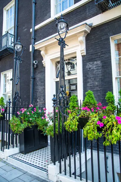 stock image London, UK - 9 September, 2023: Beautiful entrance door of periodic building in Mayfair, one of the richest areas to live with fancy lifestyle