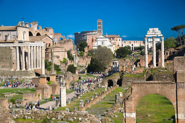ROME, ITALY - APRIL 8, 2024: Rome forum with ruins of important ancient government buildings, temple ruins and ancient roads started 7th century BC