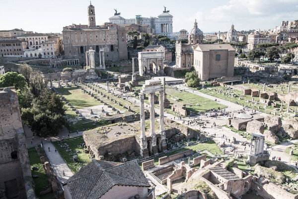 ROME, ITALY - APRIL 8, 2024: Rome forum with ruins of important ancient government buildings, temple ruins and ancient roads started 7th century BC. View From Palatine Hill