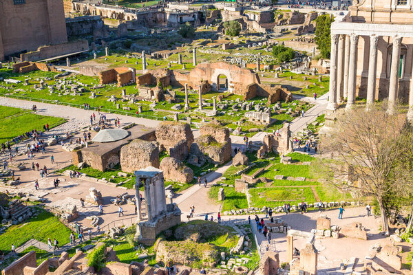 ROME, ITALY - APRIL 8, 2024: Rome forum with ruins of important ancient government buildings, temple ruins and ancient roads started 7th century BC. View From Palatine Hill