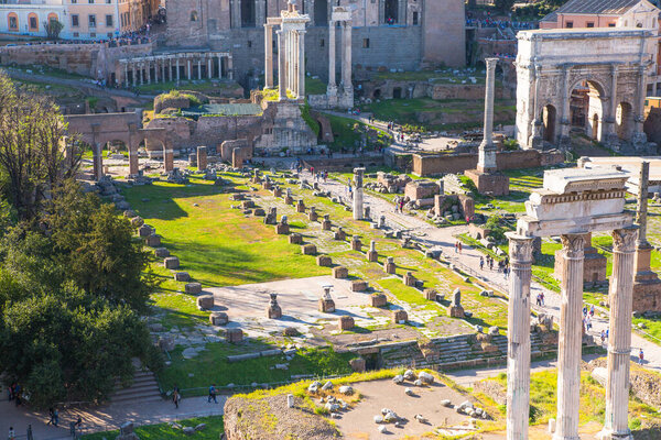 ROME, ITALY - APRIL 8, 2024: Rome forum with ruins of important ancient government buildings, temple ruins and ancient roads started 7th century BC. View From Palatine Hill