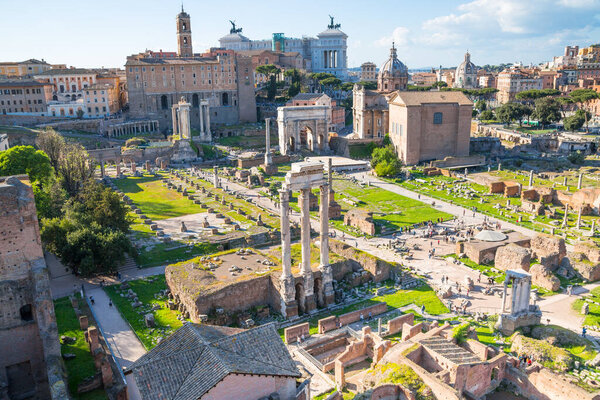 ROME, ITALY - APRIL 8, 2024: Rome forum with ruins of important ancient government buildings, temple ruins and ancient roads started 7th century BC. View From Palatine Hill