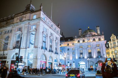 London, UK - 8 November, 2024: Spirit of Christmas, Piccadilly Circus Christmas lights, London illuminated for 2025. Crowd on streets, people enjoying festive atmosphere  clipart