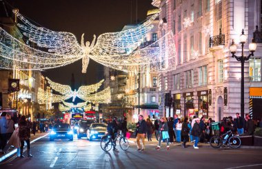 London, UK - 8 November, 2024: Spirit of Christmas, Piccadilly Circus Christmas lights, London illuminated for 2025. Crowd on streets, people enjoying festive atmosphere  clipart