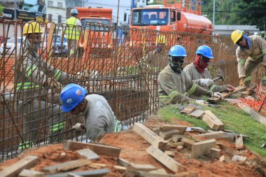 salvador, bahia, brazil - january 19, 2023: construction workers of the BRT transportation system project in the city of Salvador.