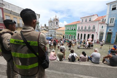 salvador, bahia, brazil - february 1, 2023: Bahia Military Police agent provides security for tourists disembarking from a cruise ship in the port of Salvador.