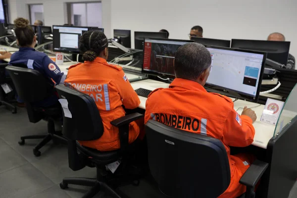 stock image salvador, bahia, brazil - february 12, 2024: Security forces professionals working at the integrated control and command center in the city of Salvador