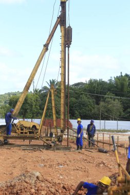 ilheus, bahia, brazil - may 23, 2022: pile driving equipment during foundations in a construction in the city of Ilheus. clipart