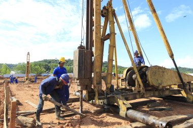 ilheus, bahia, brazil - may 23, 2022: pile driving equipment during foundations in a construction in the city of Ilheus. clipart