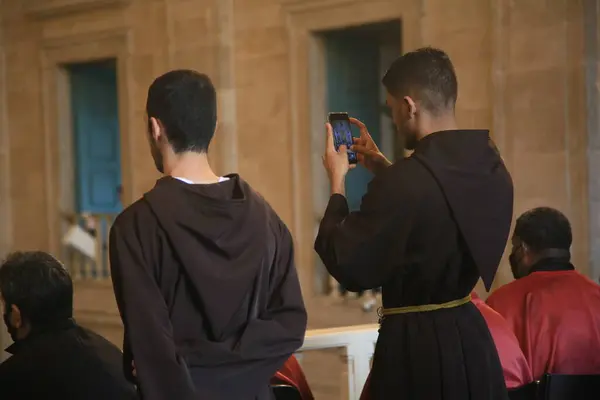 stock image salvador, bahia, brazil - june 16, 2022: Franciscan monk seen during Corpus Christi holiday celebration at the Basilica Cathedral of the city of Salvador