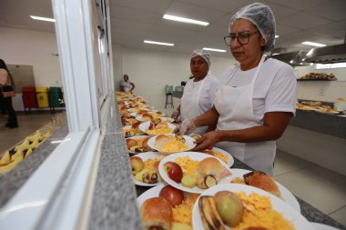 formosa do rio preto, bahia, brazil - december 8, 2023: distribution of meals in a public school cafeteria in the city of Formosa do Rio Preto clipart