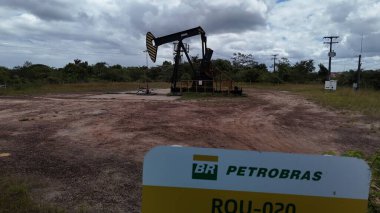 entre rios, bahia, brazil - setembro 10, 2024: oil exploration machine is seen in Petrobras' field of action in the city of Entre Rios clipart