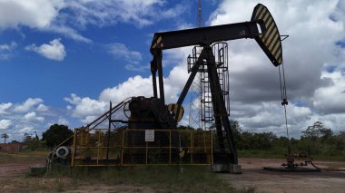 entre rios, bahia, brazil - setembro 10, 2024: oil exploration machine is seen in Petrobras' field of action in the city of Entre Rios clipart