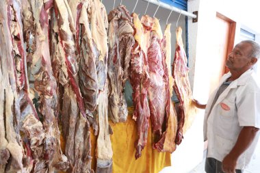 itapebi, bahia, brazil - august 17, 2024: sale of meat of animal origin in a municipal market in the city of Itapebi. clipart