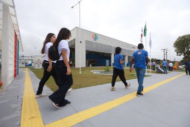 itororo, bahia, brazil - august 28, 2024: students are seen in the courtyard of a public school in the city of Itororo. clipart