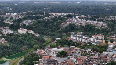 salvador, bahia, brazil - october 16, 2024: Aerial view of housing in a favela community in the city of Salvador. clipart