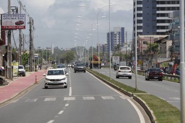 ilheus, bahia, brazil - october 7, 2022: Vehicle movement on the duplication section of the BA-001 state highway, on the southern edge of the city of Ilheus. clipart