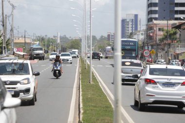 ilheus, bahia, brazil - october 7, 2022: Vehicle movement on the duplication section of the BA-001 state highway, on the southern edge of the city of Ilheus. clipart