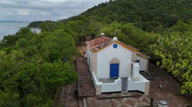 salvador, bahia, brazil - december 18, 2024: view of the Church of Our Lady of Guadalupe on Ilha dos Frades in the municipality of Salvador. clipart