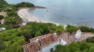 salvador, bahia, brazil - december 18, 2024: aerial view of frades island in the municipality of salvador. clipart