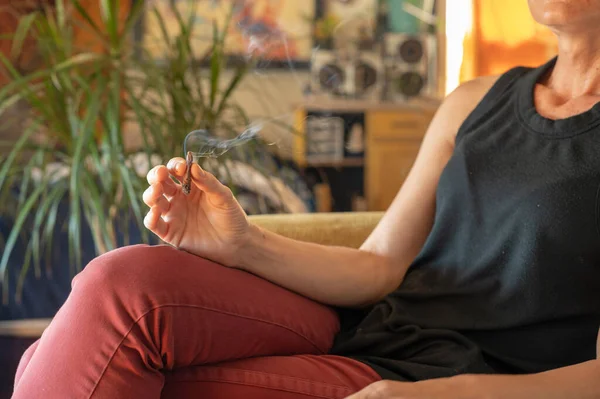 Person Seen Smoking Cannabis Joint Indoors Stock Photo