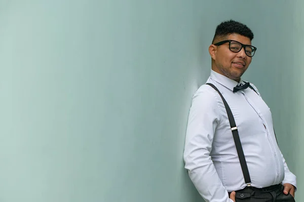 stock image Portrait of young man leaning against wall