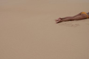 Woman seen laying in sun with copy space