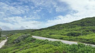 Tranquil scene in nature with rolling hills and blue sky