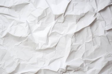 Buruşmuş beyaz kağıt, yakından atılmış.