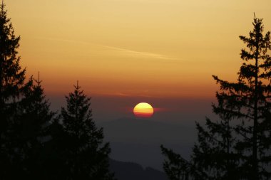 Sunset at Rechelberg mountain,, Bavaria, Germany,  in wintertime clipart