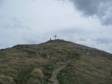 Krottenkopf mountain summit cross, Bavaria, Germany in springtime clipart