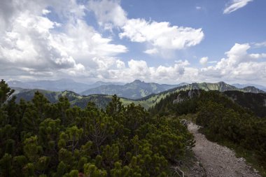 Mountain hiking at Brecherspitze mountain in summertime, Bavaria, Germany clipart