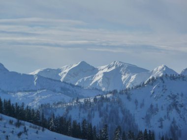 Mountain hiking at Brecherspitze mountain in wintertime, Bavaria, Germany clipart