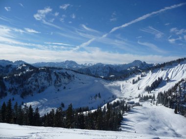 Mountain hiking at Brecherspitze mountain in wintertime, Bavaria, Germany clipart