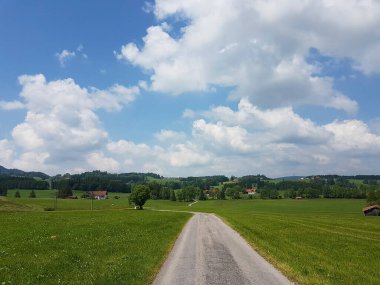 Hiking trail from Steingaden to Bernbeuren, Munich Way of St. James, Bavaria, Germany in summertime clipart