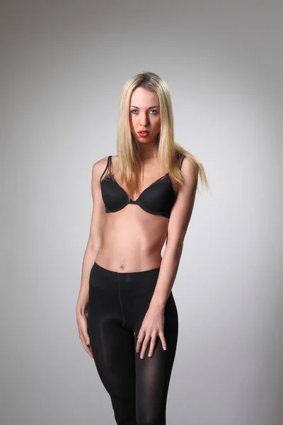 Young Slim Woman Pantyhose Bra Gray Background — Stockfoto