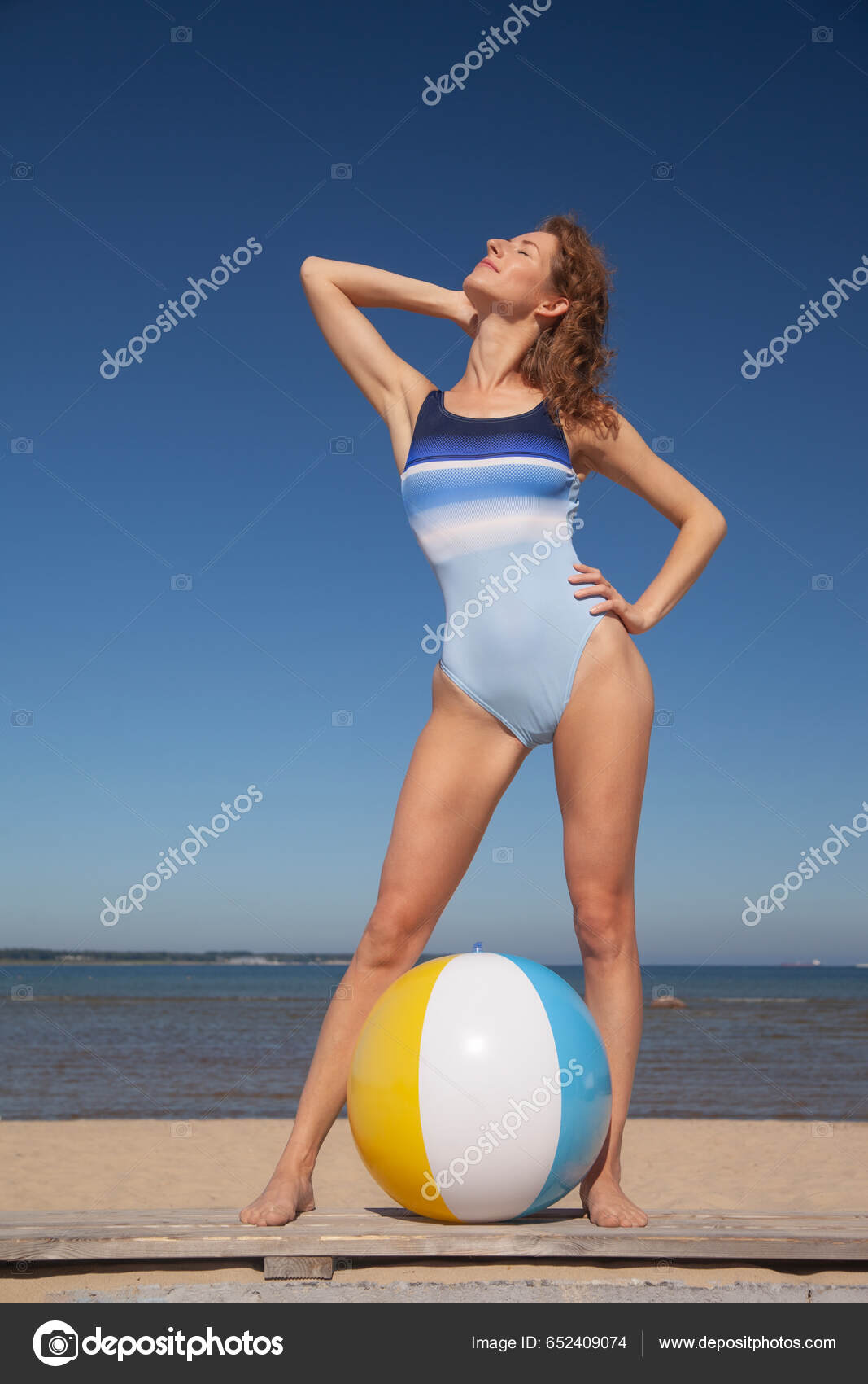 Young Slim Woman Swimsuit Beach Ball Stock Photo by ©zhagunov 652409074