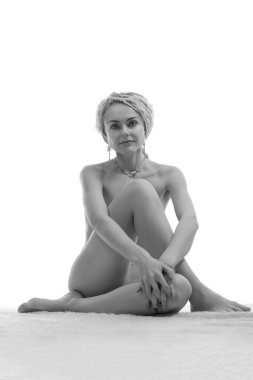 young woman naked yoga on white background