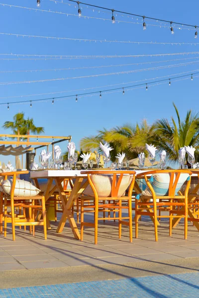 Tables arranged for an outdoor event.