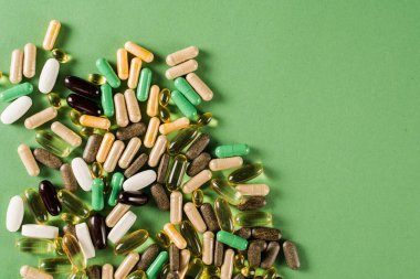 Mix of dietary biologically active supplement tablets for healthy diet for every day. Set of mulvitamin, amino acids, minerals and magnesium antistress, melatonin close-up